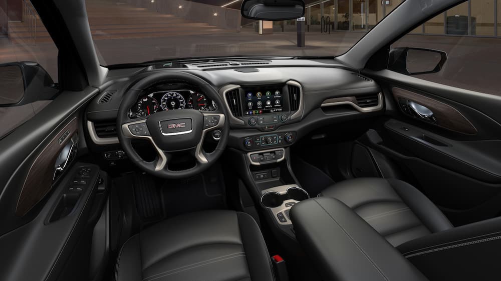 The interior of a 2023 GMC Terrain Denali is shown from the driver's seat.