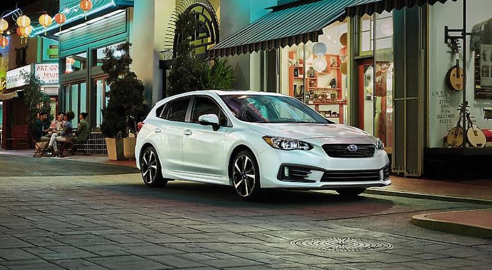 A white 2022 Subaru Impreza is shown from the front at an angle.
