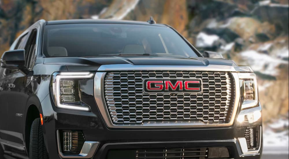 A close up shows the grille on a black 2023 GMC Yukon Denali.