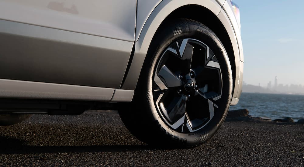 A close up shows the black wheel on a 2023 Kia Niro EV.