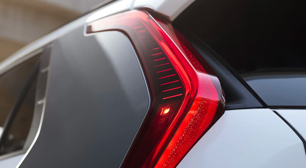 A close up shows the driver side taillight on a silver 2023 Kia Niro EV.