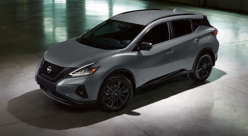 A dary grey 2023 Nissan Murano Midnight Edition is shown in a modern gallery.