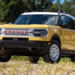 A yellow 2023 Ford Bronco Sport is shown from the front at an angle after leaving a Ford dealership.