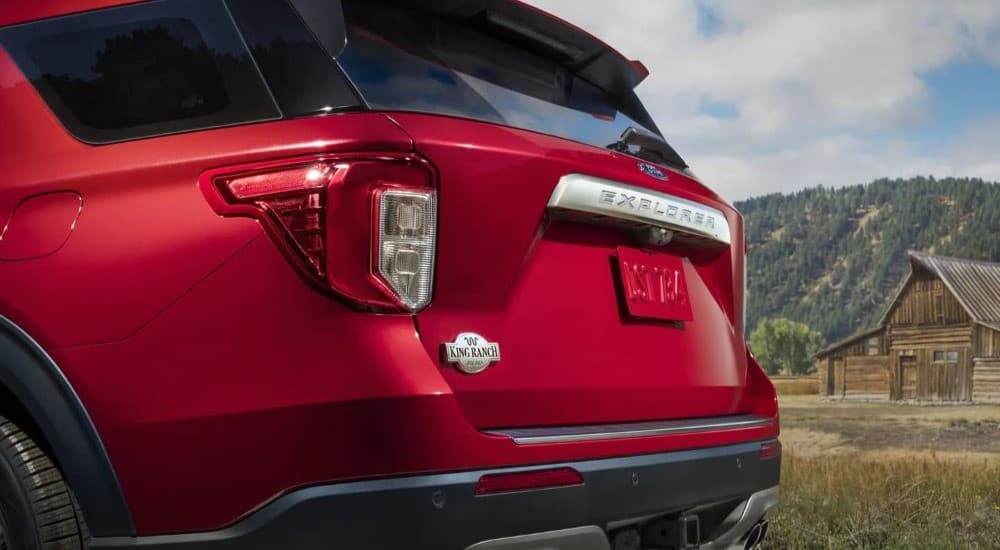 The trunk badge is shown on a red 2023 Ford Explorer King Ranch.