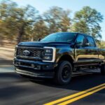A black 2023 Ford F-250 Super Duty is shown from the front at an angle.