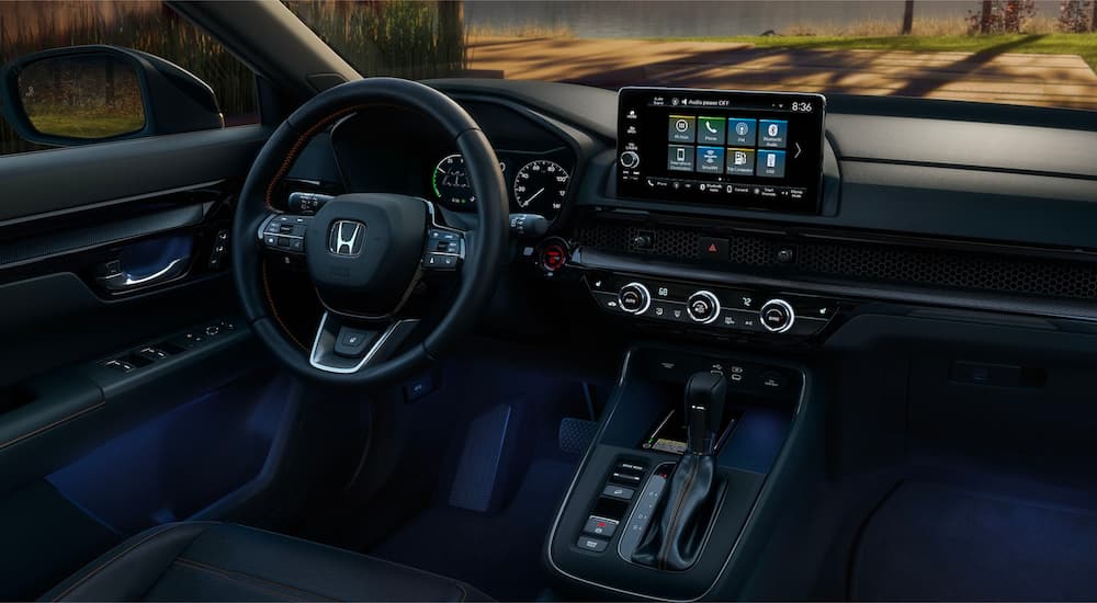 A close up shows the dash and infotainment screen in a 2023 Honda CR-V Sport Touring.