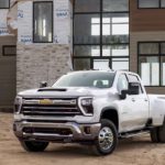 A white 2024 Chevy Silverado 3500HD LTZ is shown from the front at an angle.