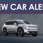 A white 2024 Kia EV9 is shown under a new car alert banner.