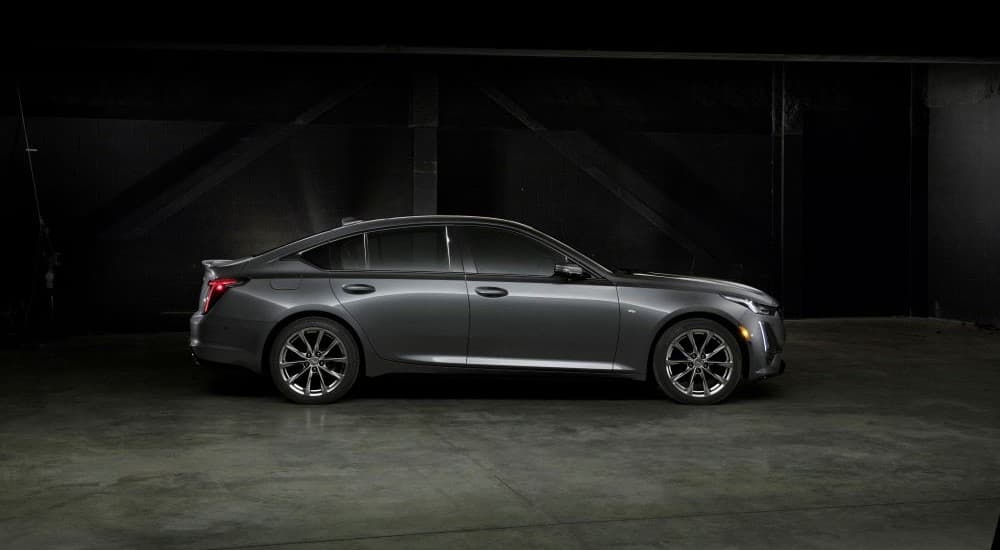 A grey 2020 Cadillac CT5 Sport is shown from the side against a dark background.