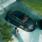 A black 2023 Mercedes-Benz EQE is shown from above parked in a driveway.