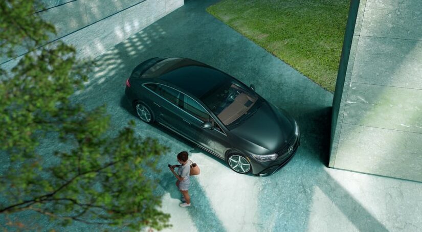 A black 2023 Mercedes-Benz EQE is shown from above parked in a driveway.