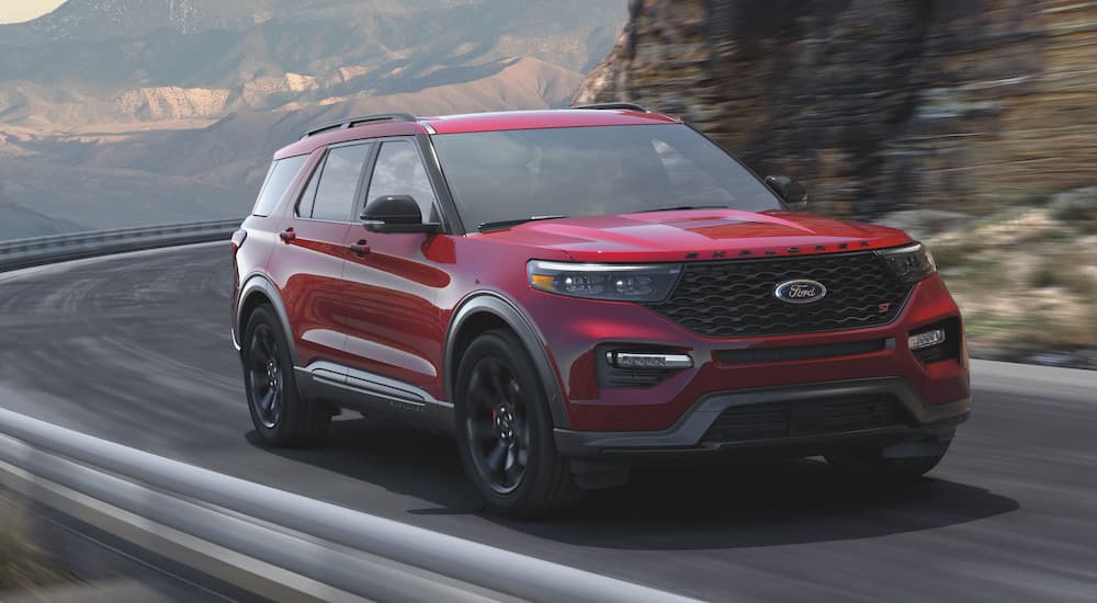 A red 2023 Ford Explorer ST is shown from the front at an angle.