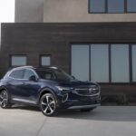 A black 2023 Buick Envision is shown from the front at an angle.