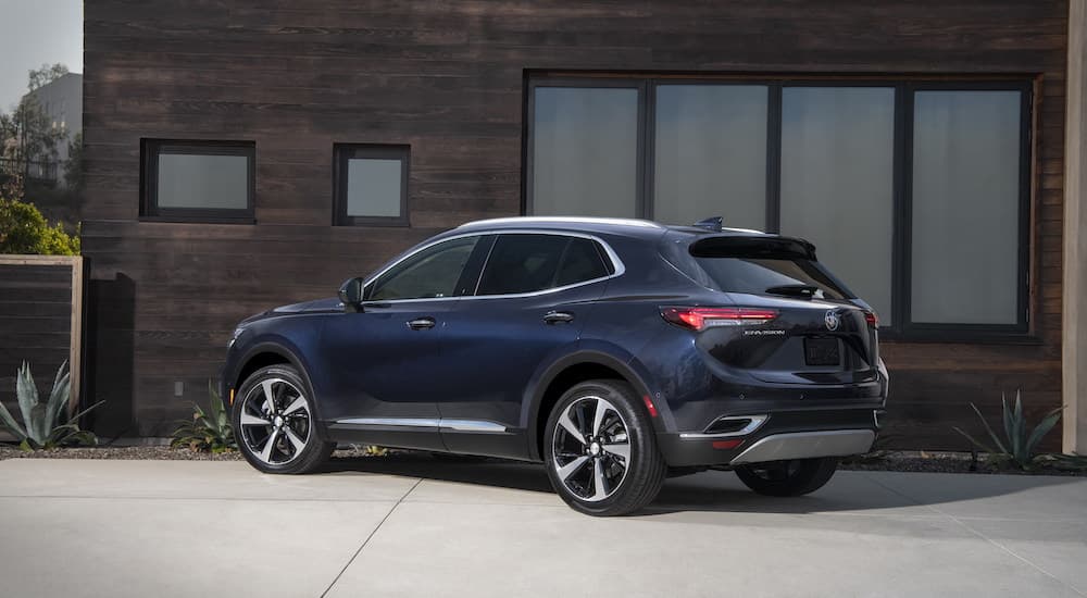 A black 2023 Buick Envision is shown from the rear at an angle.