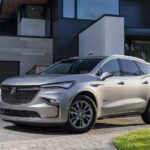 A silver 2023 Buick Enclave Avenir is shown from the front at an angle.