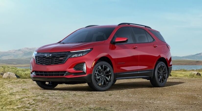 a red 2023 Chevy Equinox RS is shown from the front at an angle.