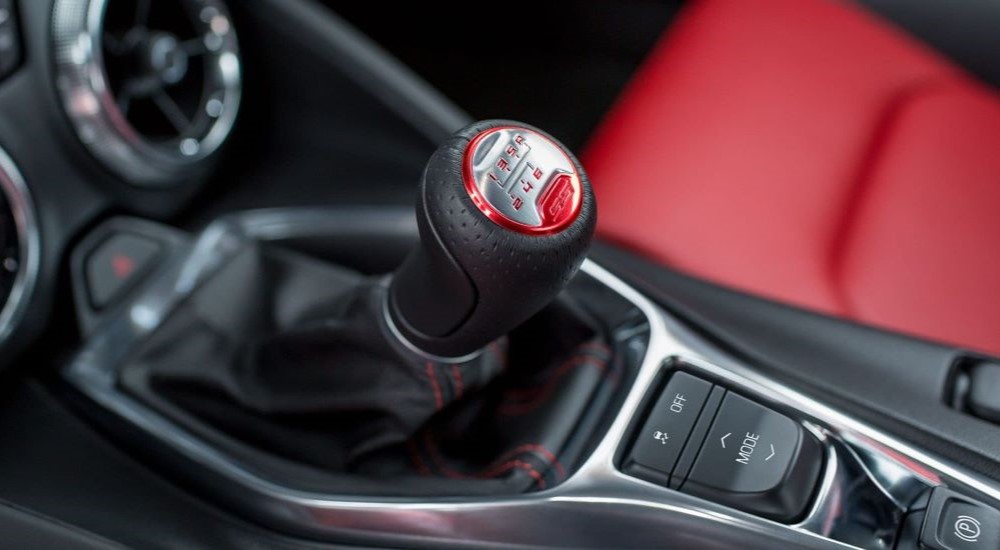A close up of the center gearshift of the 2023 Camaro SS is shown. 