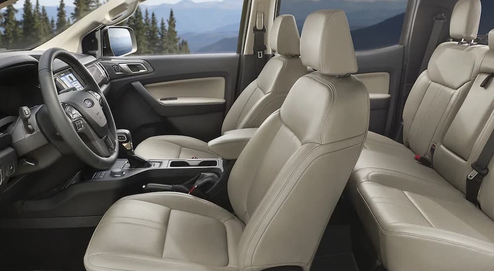 The interior of a 2023 Ford Ranger SuperCrew with Medium Stone leather seats.