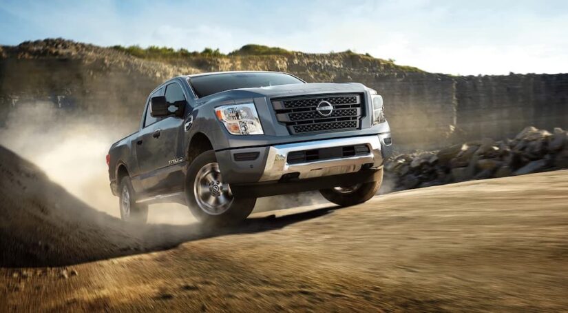 A grey 2024 Nissan Titan XD is shown from the front at an angle.