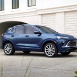 A blue 2024 Buick Encore GX Avenir is shown parked in a driveway after leaving a Buick dealer.