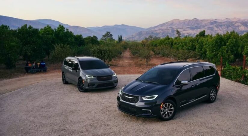 A grey and a black 2023 Chrysler Pacifica are shown.