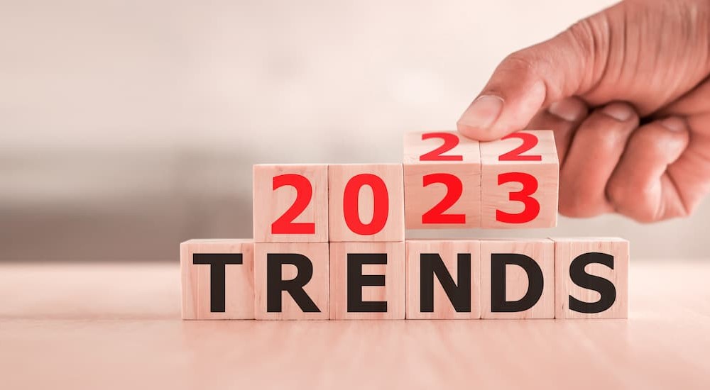 Wooden blocks are shown stating 2023 trends.