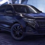 A black 2023 Chevy Equinox Midnight Edition is shown parked.