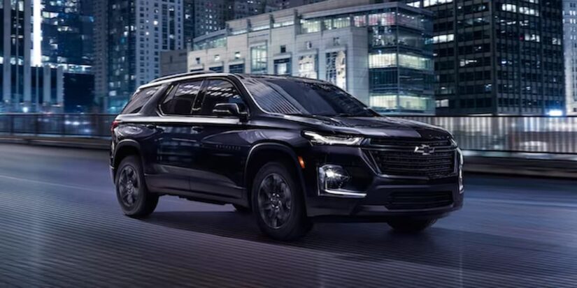 A black 2023 Chevy Traverse Midnight Edition is shown from the side after winning a 2023 Chevy Traverse vs 2023 Kia Telluride comparison.
