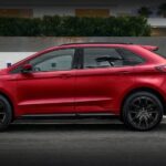 A red 2023 Ford Edge ST is shown parked on a street.