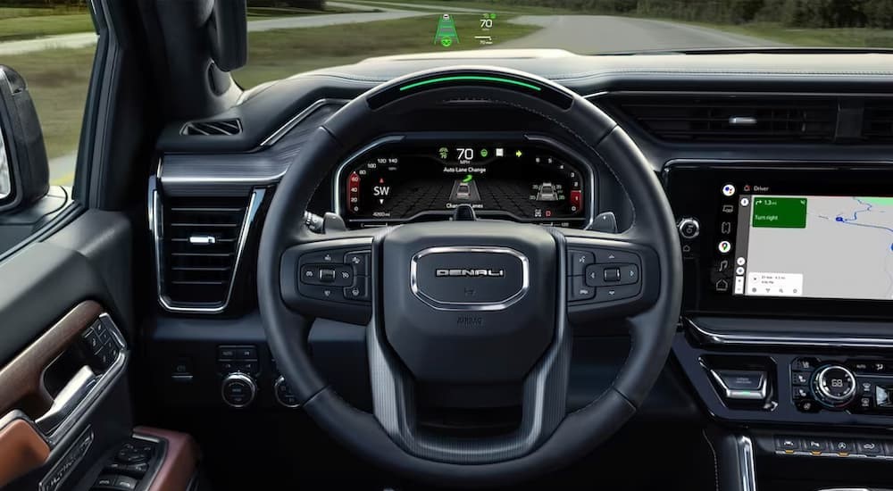 The black interior and dash of a 2023 GMC Sierra 1500 Pro is shown.
