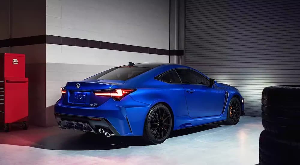 A blue 2023 Lexus RCF is shown from the rear at an angle.