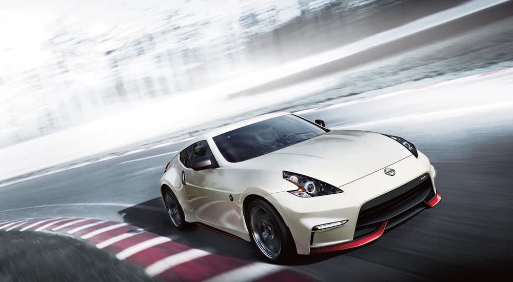 A white 2020 Nissan 370z Nismo is shown from the front at an angle.