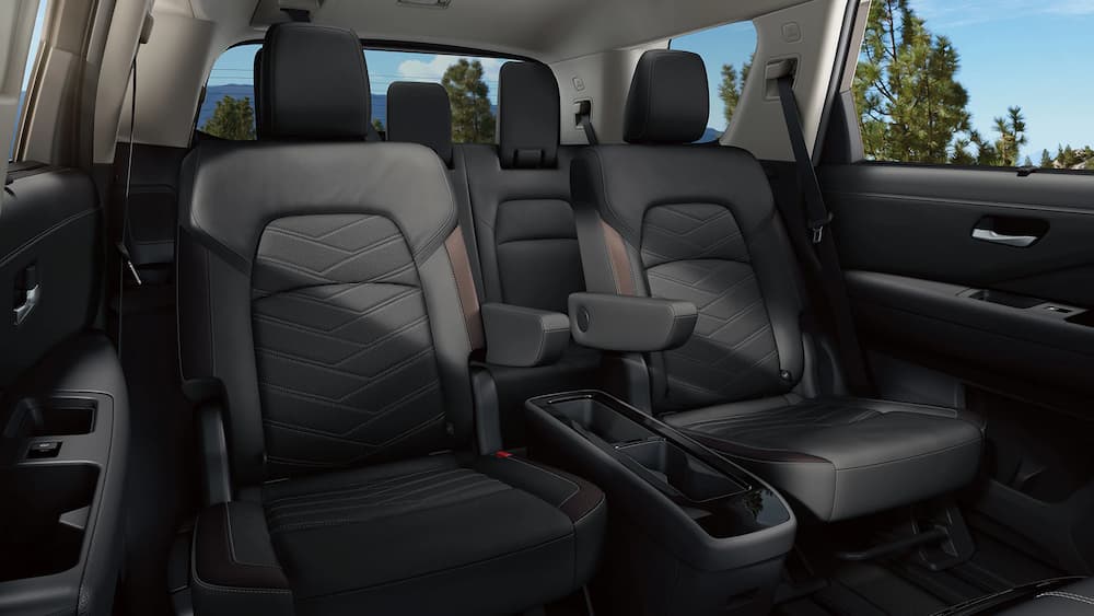 The black interior of a 2023 Nissan Pathfinder is shown.