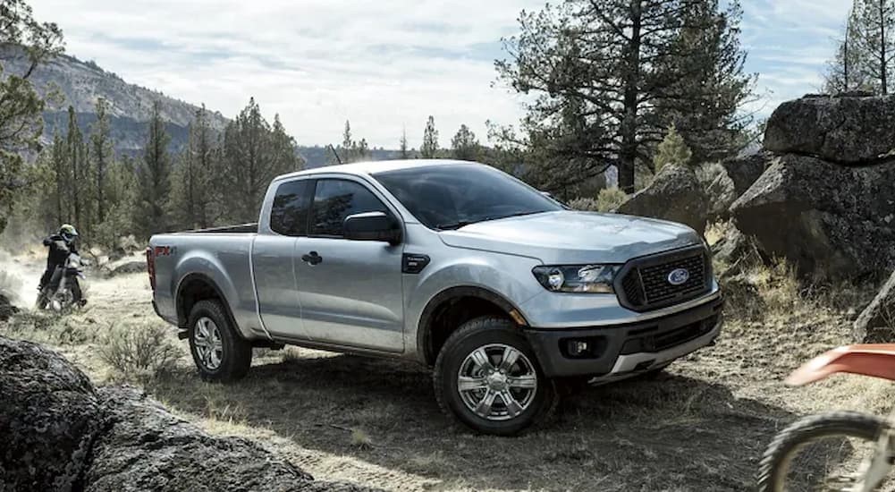 A silver 2023 Ford Ranger STX FX4 is shown off-roading.