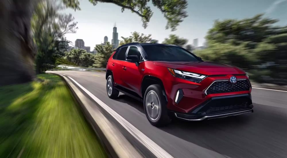A red 2023 Toyota RAV4 Prime XSE is shown from the front at an angle.