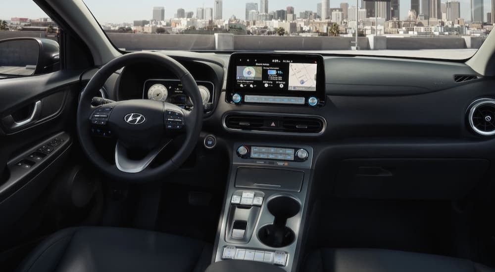 The black interior and dash of a 2023 Hyundai Kona Electric is shown.