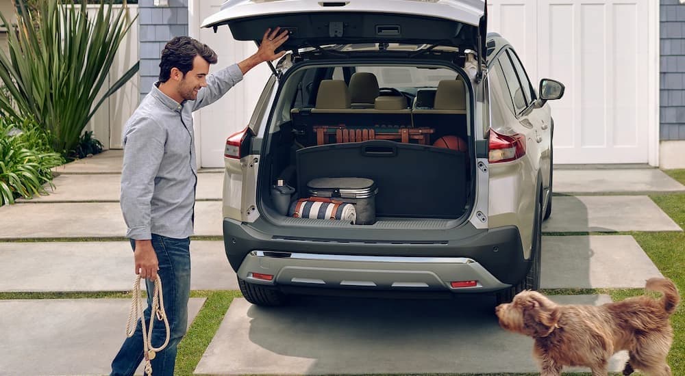 Cargo space is shown in a tan 2023 Nissan Rogue.