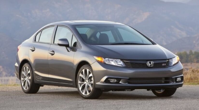 A popular vehicle for used car sales, a gray 2013 Honda Civic Si, is shown.