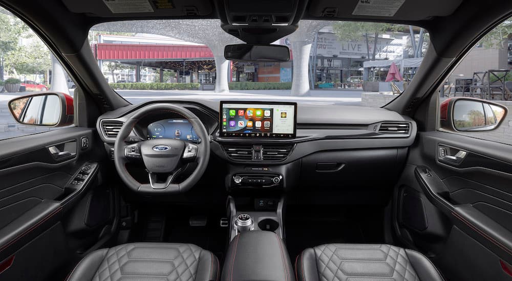 The black interior of a 2023 Ford Escape ST is shown from above the center console.