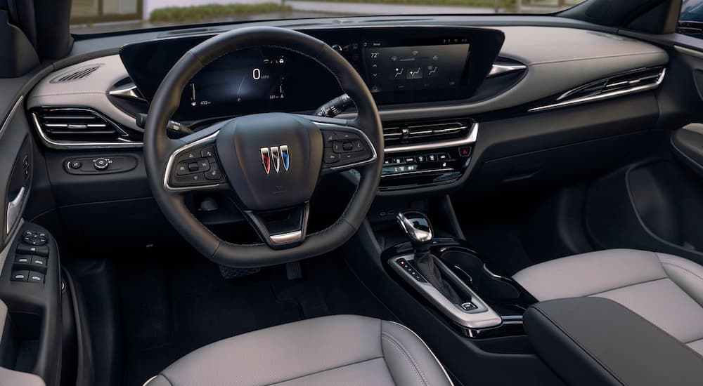 The grey interior of a 2024 Buick Envista Avenir is shown from the driver's seat.