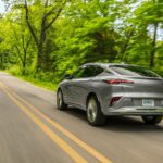A grey 2024 Buick Envista Avenir is shown from the rear at an angle.