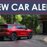 A red 2024 Chevy Traverse RS is shown from the rear at an angle under a new car alert banner.
