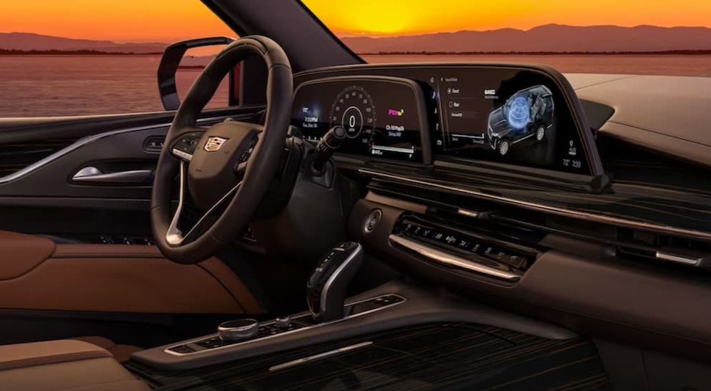 The multicolored interior and dash of a 2023 Cadillac Escalade is shown.
