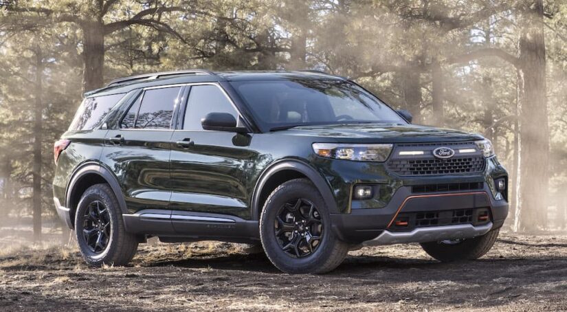 A green 2021 Ford Explorer Timberline is shown from the side at an angle.