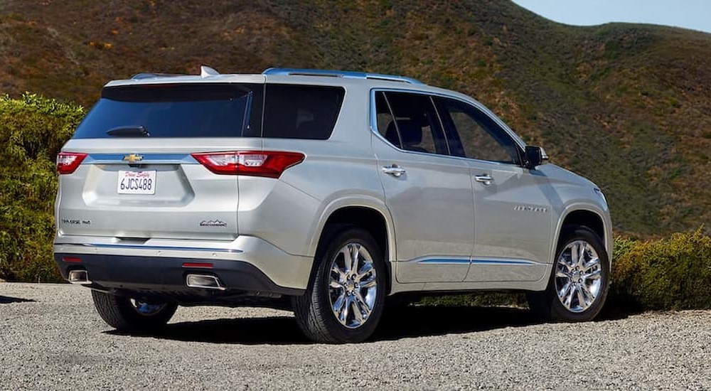 A silver 2019 Chevy Traverse is shown parked off-road.
