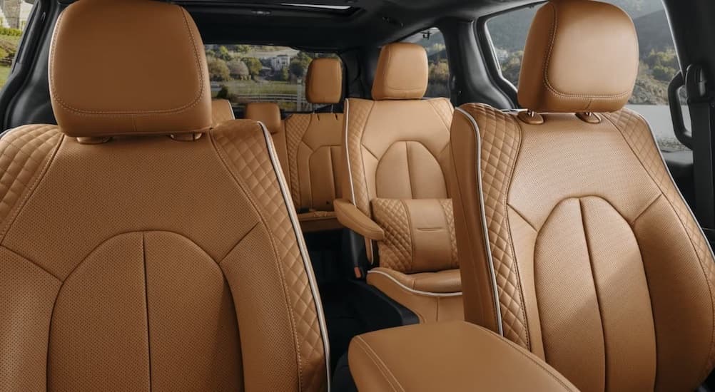 The brown interior of a 2023 Chrysler Pacifica is shown.