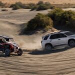 A silver 2023 Honda Pilot TrailSport is shown next to an ATV.