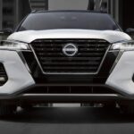 A white 2023 Nissan Kicks is shown from the front after winning a 2023 Nissan Kicks comparison.