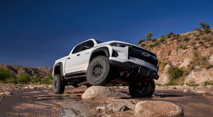 A white 2023 Chevy Colorado ZR2 Bison is shown from the front at an angle during a 2023 Chevy Colorado vs 2023 Ford Ranger comparison.