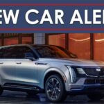 A 2025 Cadillac Escalade IQ Sport is shown from the front at an angle.
